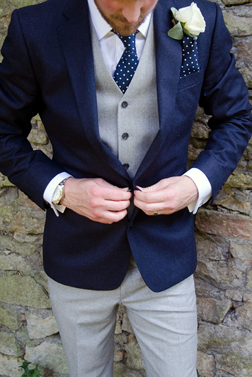 Man in twenties in black waistcoat white shirt grey trousers and glasses  looks thoughtful Stock Photo  Alamy