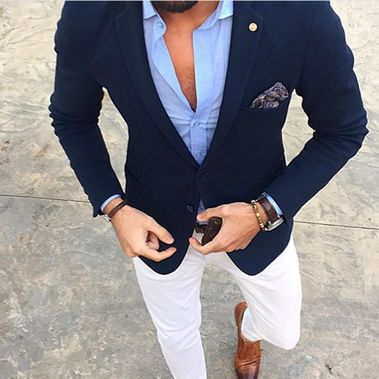 Navy blue single-breasted jacket with white trousers